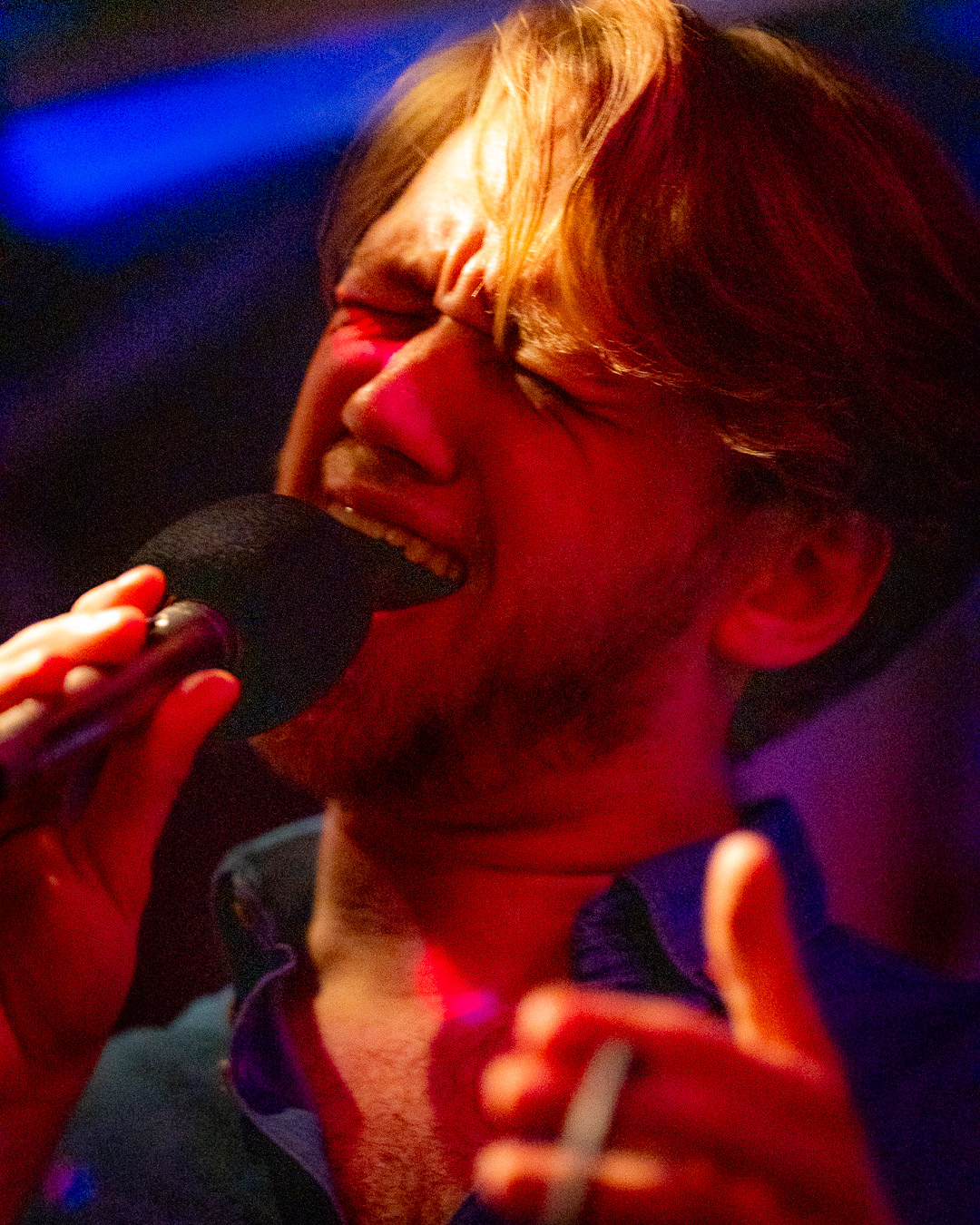 Andreas "AJ" Friedrichs singing on stage